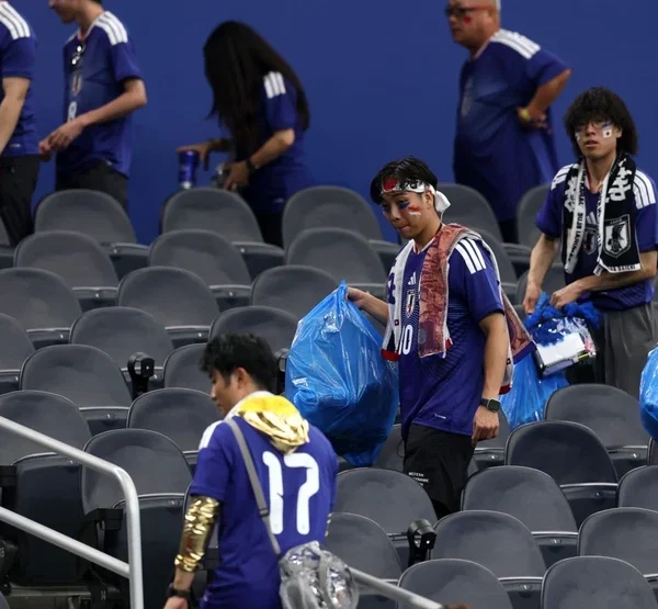 Japanese Fans Praised for Cleaning Stadium After Match {VIDEO}